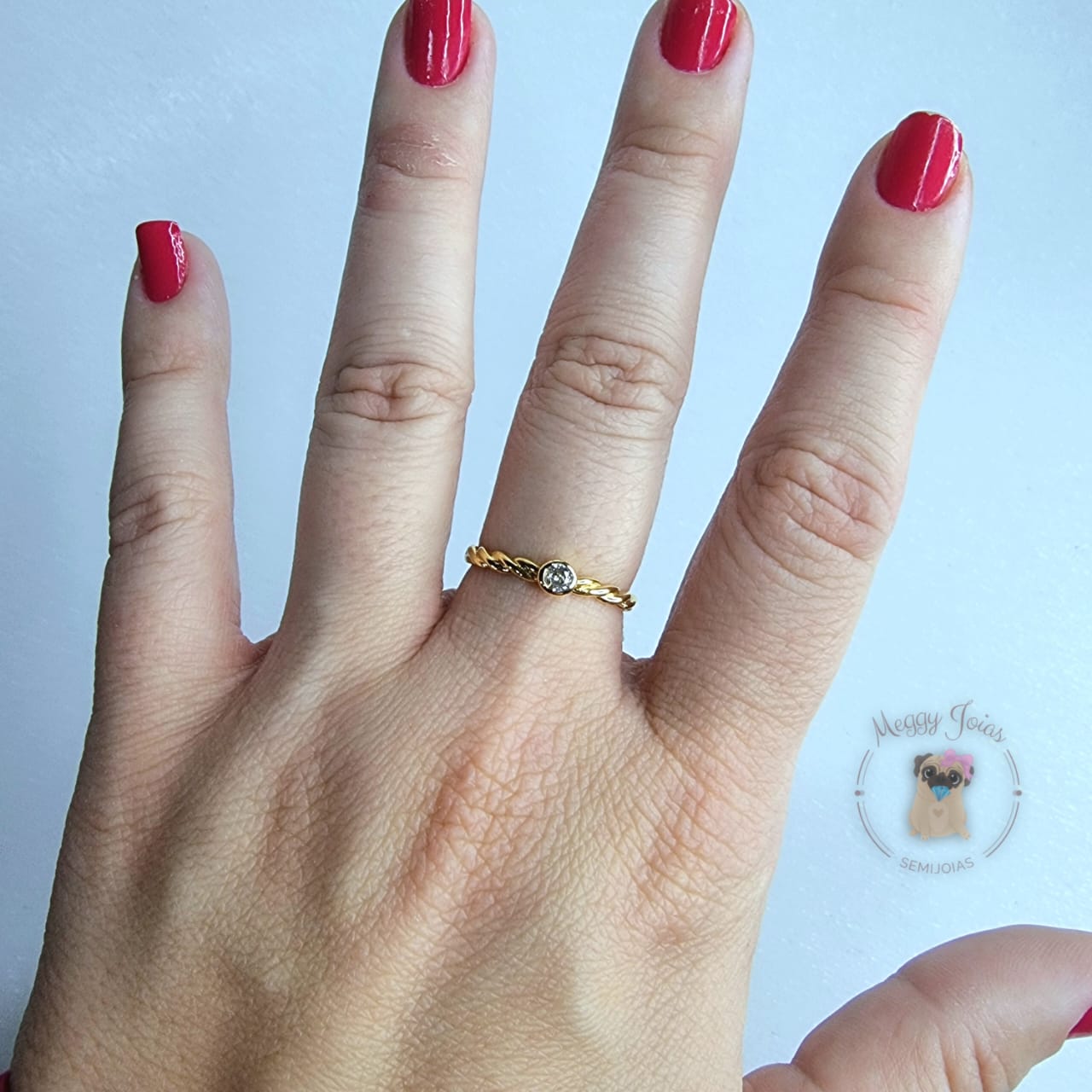 Anél folheado a ouro trabalhado trançado